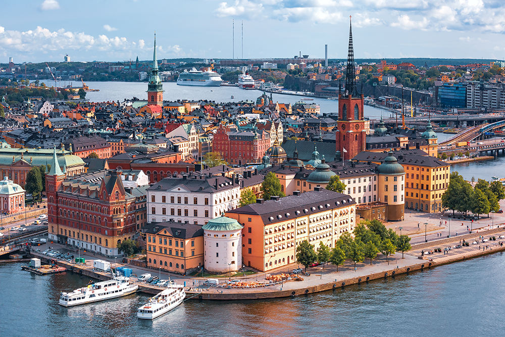 A city with many buildings and boats in the water