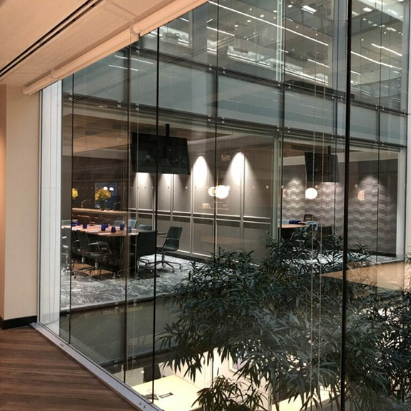 A large glass wall in an office building.