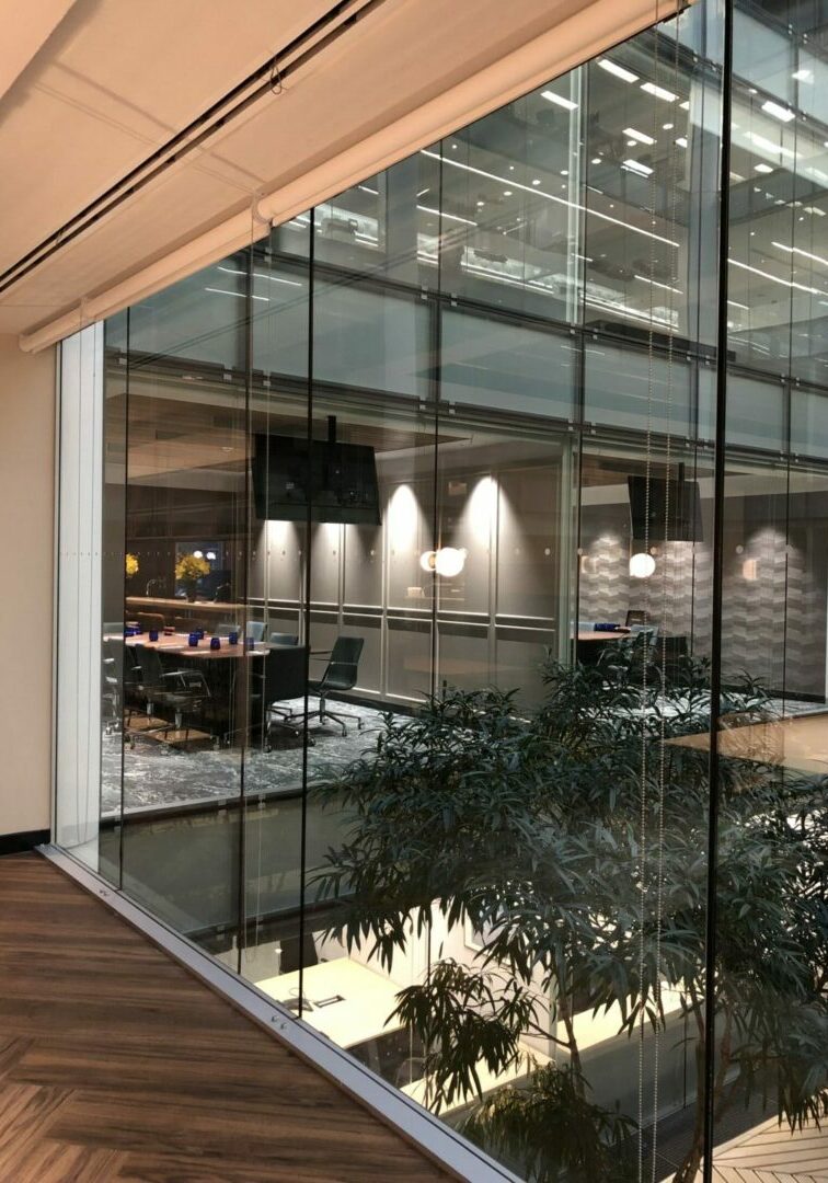 A large glass wall in an office building.